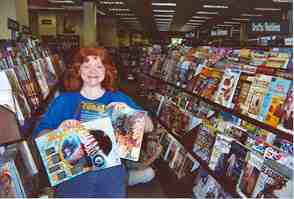 Ruth showing off magazines at bookstore